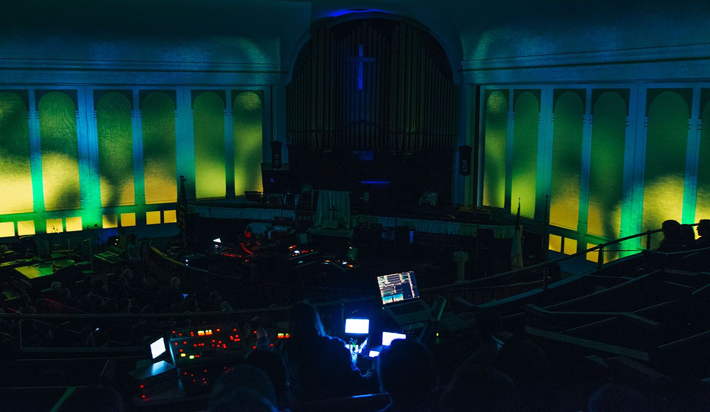 a church with projection mapped visuals around a stage