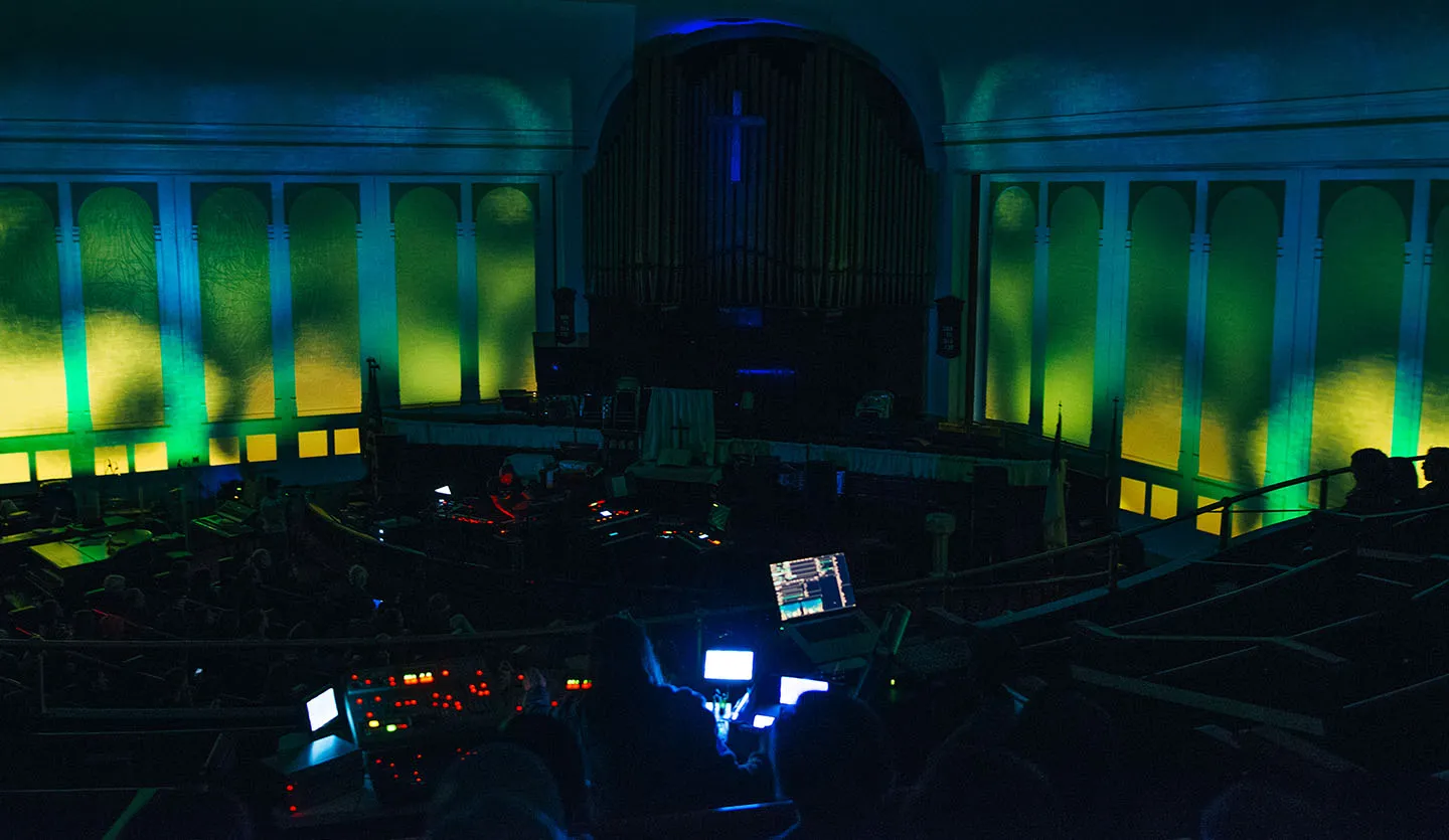 a church with projection mapped visuals around a stage