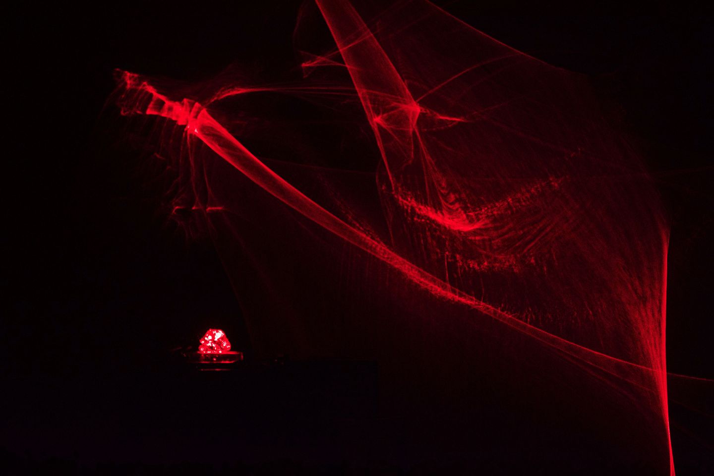 red abstract light patterns in a dark space