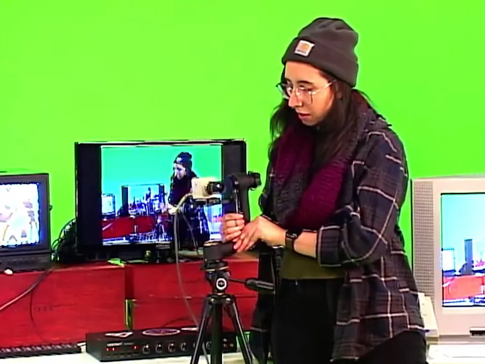 Paloma Kop operating a camera at TV club