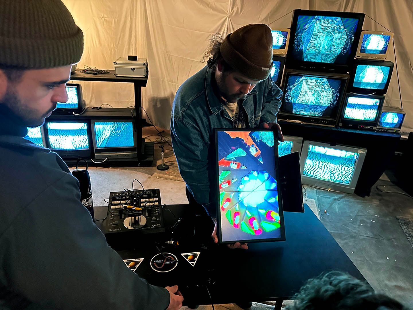 Photo of people creating analog video feedback at Rochester workshop