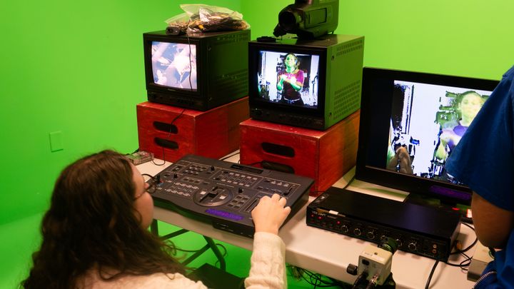 A student using the analog video mixer