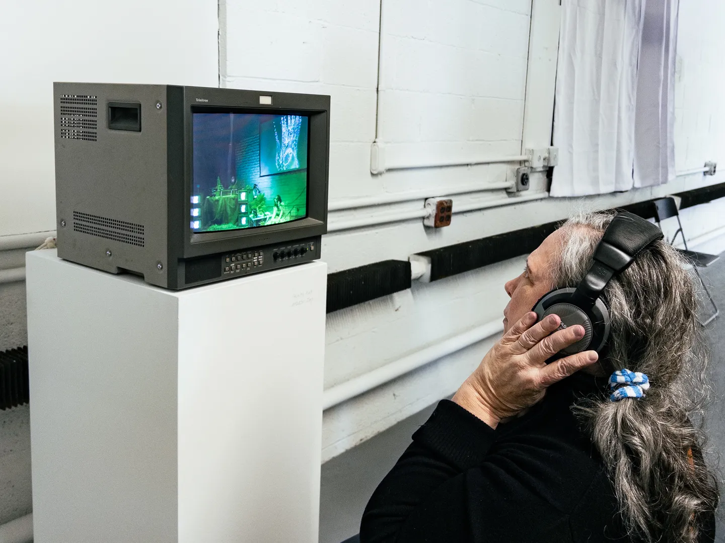 a viewer watching the video piece